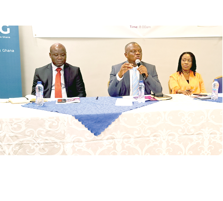 Clement Osei-Amoako (middle), President, GNCCI, addressing the participants. With him are Mark Badu-Aboagye (left), CEO, GNCCI, and Dr Emelia Assiakwa, National Treasurer, GNCCI, at the forum 1,000 SMEs build competitiveness